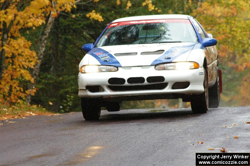 Paul Ritchie / Drew Ritchie Mitsubishi Eclipse GSX at the midpoint jump on Brockway, SS10.