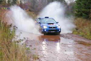 Travis Pastrana / Christian Edstrom Subaru WRX STi hit the big puddle near the end of Gratiot Lake 2, SS14, at speed.