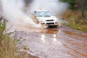 Matt Iorio / Ole Holter Subaru Impreza hits the final big puddle at the end of Gratiot Lake 2, SS14, at speed.