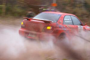 Matthew Johnson / Wendy Nakamoto Subaru WRX exits the final big puddle at the end of Gratiot Lake 2, SS14, at speed.