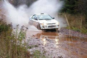 Henry Krolikowski / Cindy Krolikowski Subaru WRX hits the final big puddle at the end of Gratiot Lake 2, SS14, at speed.