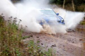 Mark McElduff / Damien Irwin Subaru WRX STi hits the final big puddle at the end of Gratiot Lake 2, SS14, at speed.