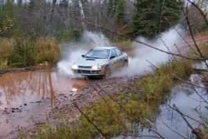 Russ Hodges / Mike Rossey Subaru Impreza hits the final big puddle at the end of Gratiot Lake 2, SS14, at speed.