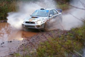 Fintan Seeley / Paddy McCague Subaru WRX STi hits the final big puddle at the end of Gratiot Lake 2, SS14, at speed.