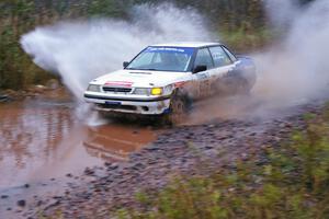 Mike Wray / Don DeRose Subaru Legacy Sport hits the final big puddle at the end of Gratiot Lake 2, SS14, at speed.