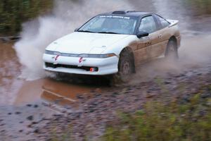 Chris Czyzio / Bob Martin Mitsubishi Eclipse GSX hits the final big puddle at the end of Gratiot Lake 2, SS14, at speed.