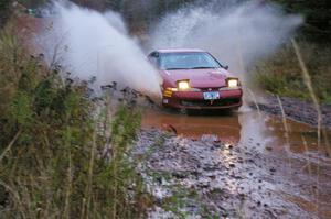 Dave LaFavor / Chris Huntington	Eagle Talon hits the final big puddle at the end of Gratiot Lake 2, SS14, at speed.