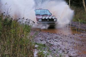 Matt Bushore / Andy Bushore VW Jetta hits the final big puddle at the end of Gratiot Lake 2, SS14, at speed.