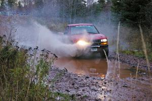 Jim Cox / Ryan LaMothe Chevrolet S-10 hits the final big puddle at the end of Gratiot Lake 2, SS14, at speed.