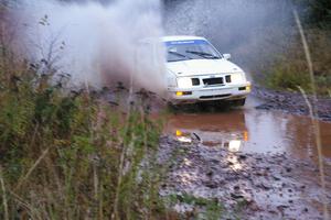 Colin McCleery / Nancy McCleery	Ford Sierra XR8 hits the final big puddle at the end of Gratiot Lake 2, SS14, at speed.