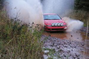 Marcin Kowalski / Maciej Sawicki Mitsubishi Eclipse GST hits the final big puddle at the end of Gratiot Lake 2, SS14, at speed.