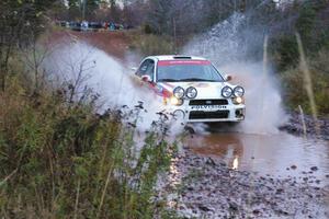 Yurek Cienkosz / Lukasz Szela Subaru Impreza RS hits the final big puddle at the end of Gratiot Lake 2, SS14, at speed.