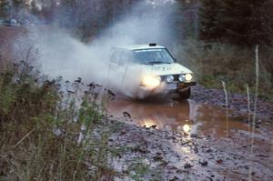 Brett Fairbanks / Chris Greenhouse VW Rabbit hits the final big puddle at the end of Gratiot Lake 2, SS14, at speed.