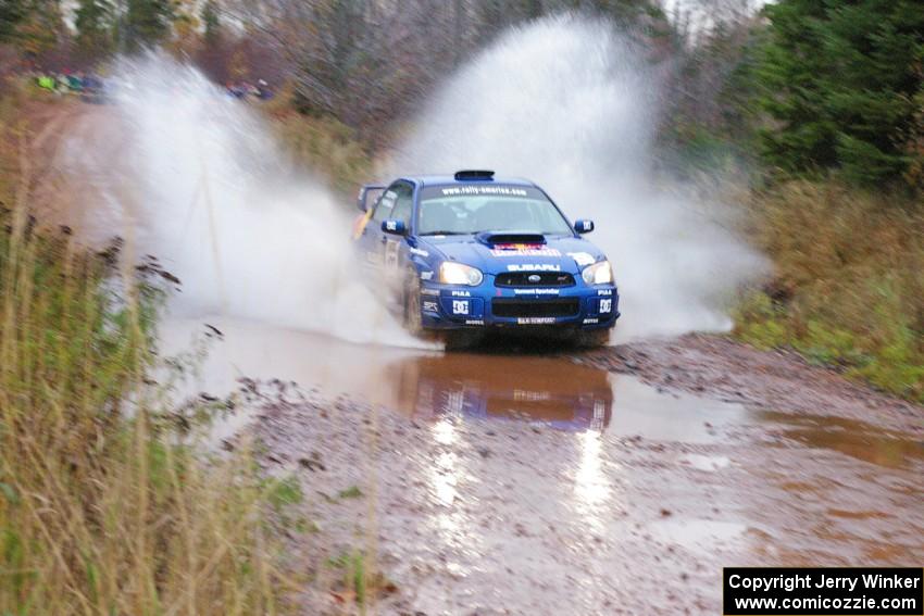 Travis Pastrana / Christian Edstrom Subaru WRX STi hit the big puddle near the end of Gratiot Lake 2, SS14, at speed.