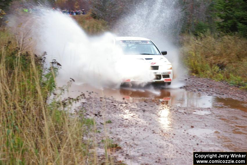 Alfredo De Dominicis / Massimo Daddoveri Mitsubishi Lancer Evo 7 hits the final big puddle at Gratiot Lake 2, SS14, at speed.