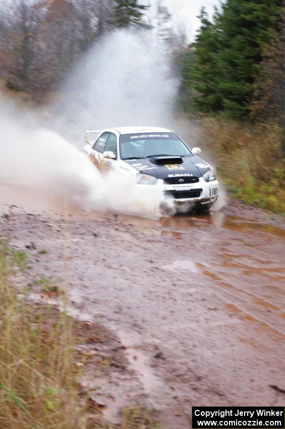 Ken Block / Alex Gelsomino Subaru WRX STi hits the final big puddle at the end of Gratiot Lake 2, SS14, at speed.