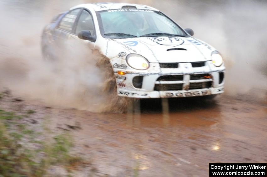 Doug Shepherd / Pete Gladysz Dodge SRT-4 hits the final big puddle at the end of Gratiot Lake 2, SS14, at speed.