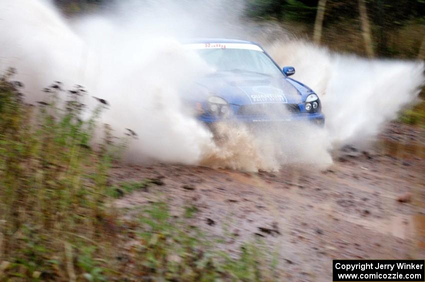 Mark McElduff / Damien Irwin Subaru WRX STi hits the final big puddle at the end of Gratiot Lake 2, SS14, at speed.