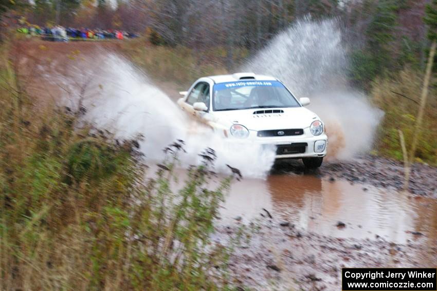 Fintan McCarthy / Noel Gallagher Subaru WRX STi hits the final big puddle at the end of Gratiot Lake 2, SS14, at speed.