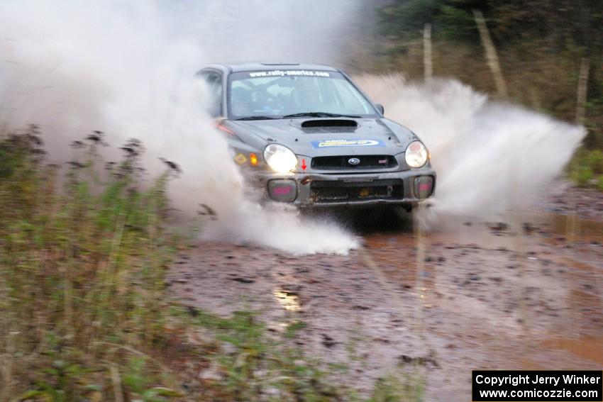 Dave Anton / Alan Ockwell Subaru WRX STi hits the final big puddle at the end of Gratiot Lake 2, SS14, at speed.