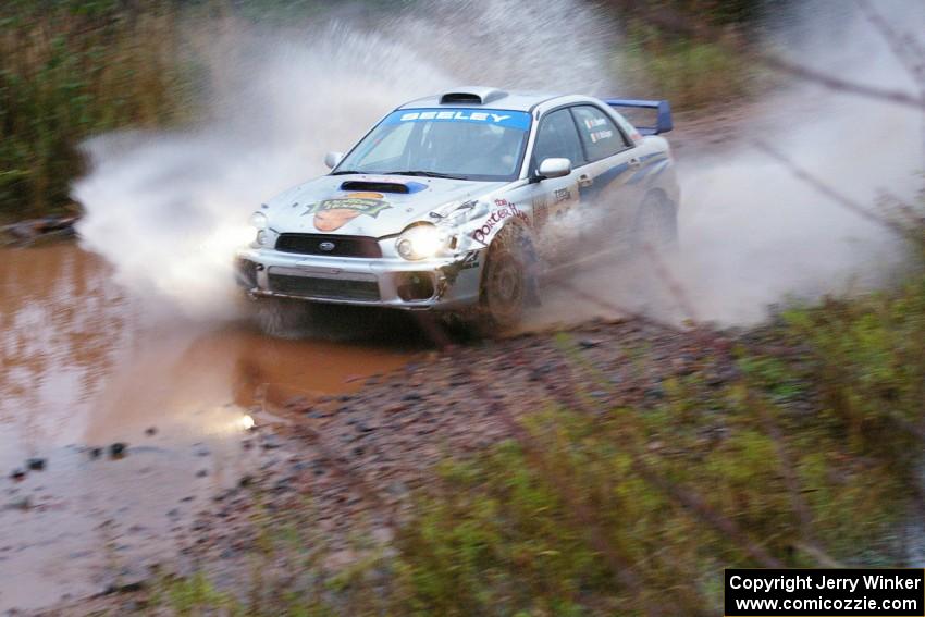 Fintan Seeley / Paddy McCague Subaru WRX STi hits the final big puddle at the end of Gratiot Lake 2, SS14, at speed.