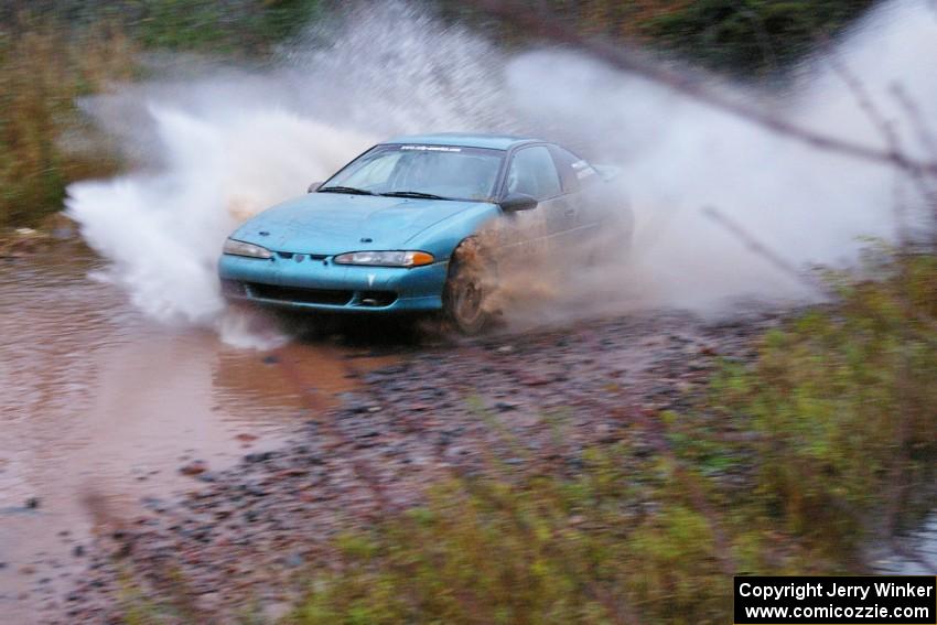 Adam Markut / John Nordlie Eagle Talon TSI hits the final big puddle at the end of Gratiot Lake 2, SS14, at speed.