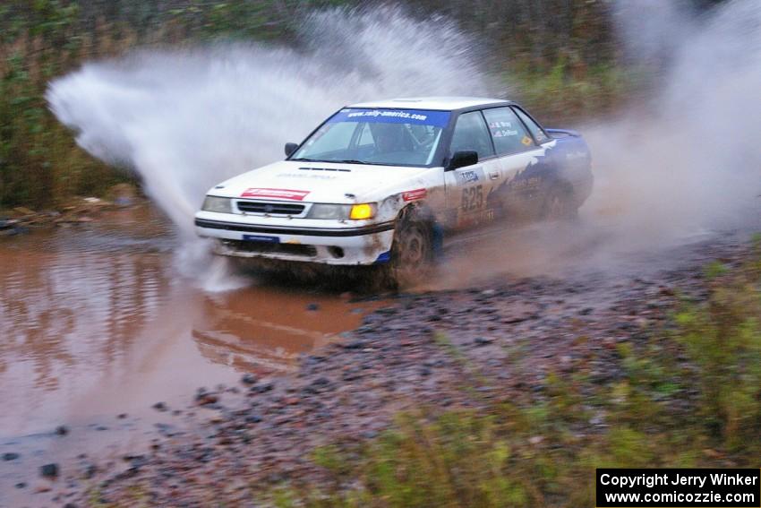 Mike Wray / Don DeRose Subaru Legacy Sport hits the final big puddle at the end of Gratiot Lake 2, SS14, at speed.