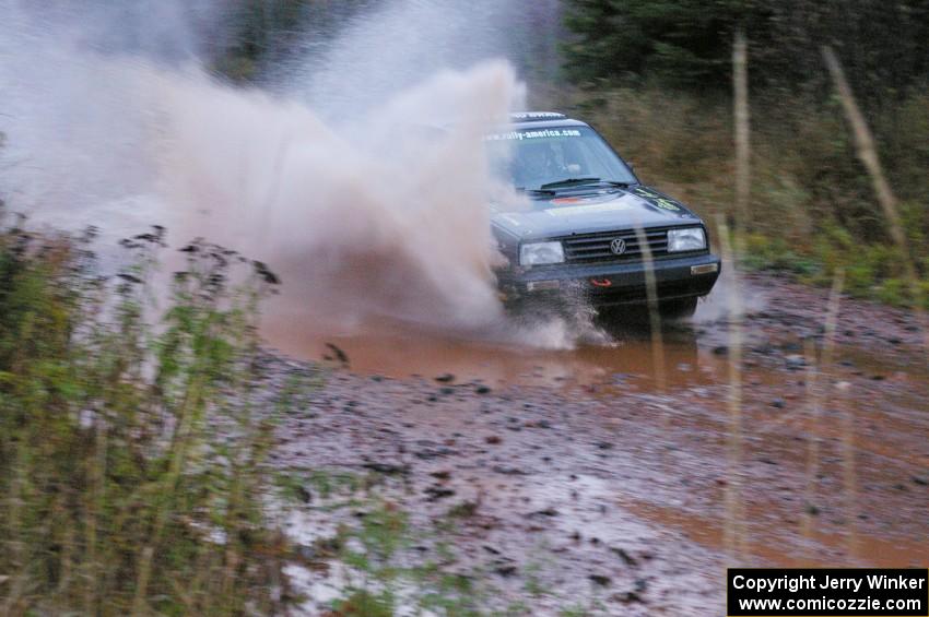 Mike Merbach / Jeff Feldt VW Jetta hits the final big puddle at the end of Gratiot Lake 2, SS14, at speed.