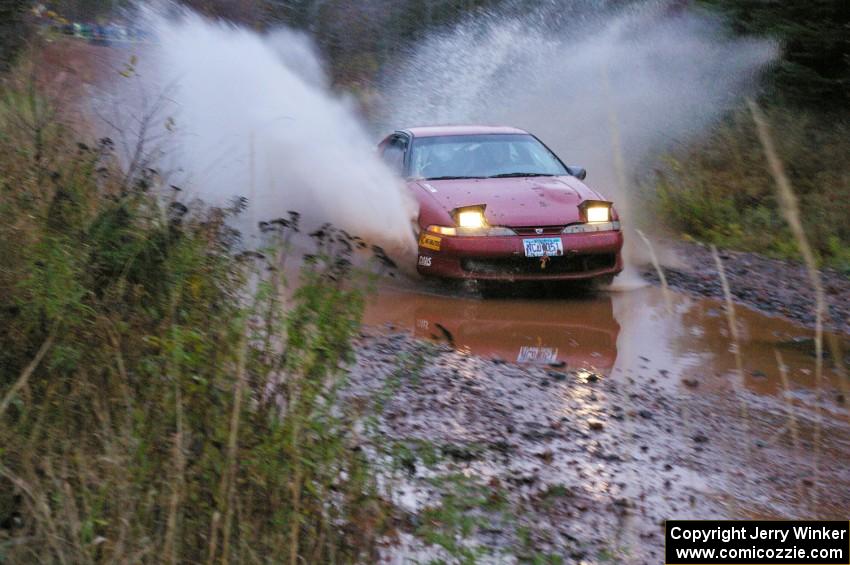 Dave LaFavor / Chris Huntington	Eagle Talon hits the final big puddle at the end of Gratiot Lake 2, SS14, at speed.