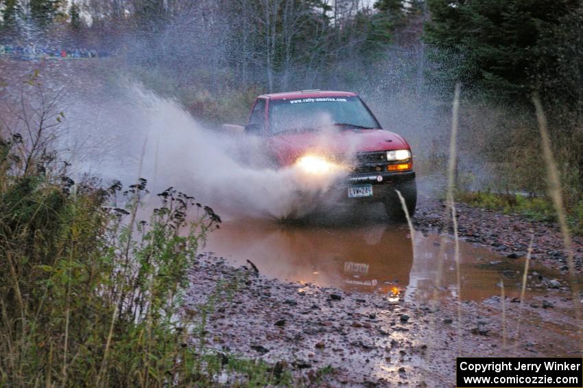 Jim Cox / Ryan LaMothe Chevrolet S-10 hits the final big puddle at the end of Gratiot Lake 2, SS14, at speed.