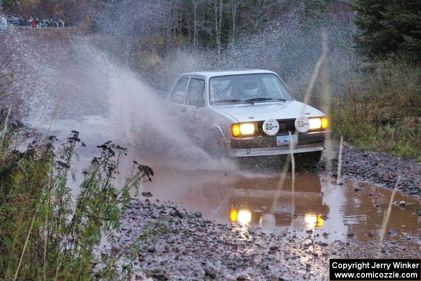 Chris Wilke / Mike Wren VW Rabbit hits the final big puddle at the end of Gratiot Lake 2, SS14, at speed.