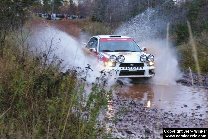 Yurek Cienkosz / Lukasz Szela Subaru Impreza RS hits the final big puddle at the end of Gratiot Lake 2, SS14, at speed.