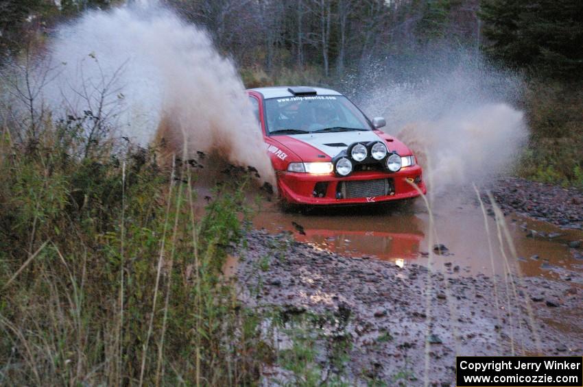 John Rek / Rob Dupree Mitsubishi Lancer Evo 6.5 hits the final big puddle at the end of Gratiot Lake 2, SS14, at speed.