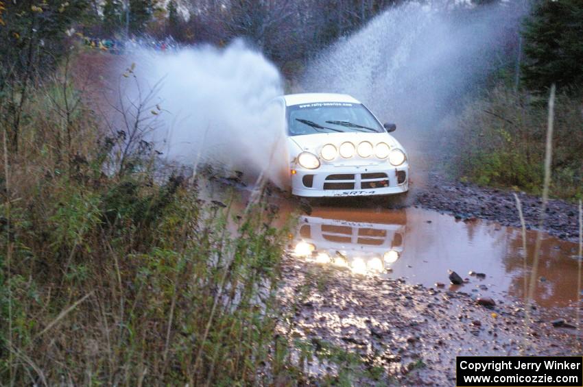 Ryan Haveman / Josh Van Den Heuvel Dodge Neon SRT-4 hits the final big puddle at the end of Gratiot Lake 2, SS14, at speed.