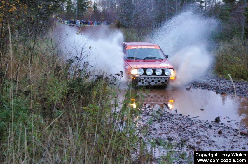 Joe Sladovich/ Kent Gardam VW GTI hits the final big puddle at the end of Gratiot Lake 2, SS14, at speed.