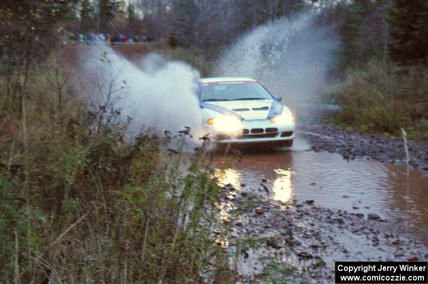 Paul Ritchie / Drew Ritchie Mitsubishi Eclipse GSX hits the final big puddle at the end of Gratiot Lake 2, SS14, at speed.