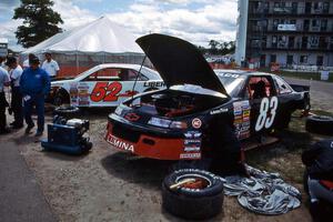 Greg Freed's Chevy Lumina and Butch Miller's Ford Thunderbird in the paddock