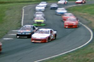 Dick Trickle's Ford Thunderbird and Johnny Benson, Jr.'s Chevy Lumina head the large field through 7/8