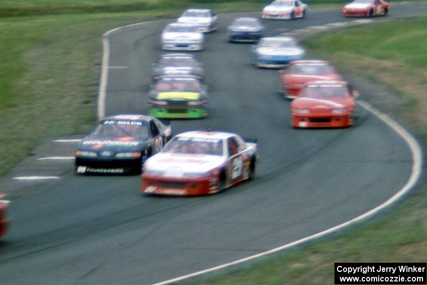 Dick Trickle's Ford Thunderbird and Johnny Benson, Jr.'s Chevy Lumina head the large field through 7/8