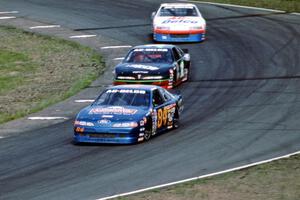 Bob Senneker's Ford Thunderbird, Jay Sauter's Chevy Lumina and Ken Schrader's Chevy Lumina