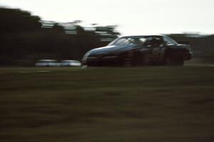 Harold Fair's Chevy Lumina gets bombarded with heavy rain during one of the qualifiers