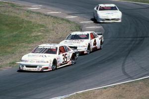 Chuck Hemmingson's Chevy Lumina, Dave Sensiba's Chevy Lumina and Steve Holzhausen's Pontiac Grand Prix