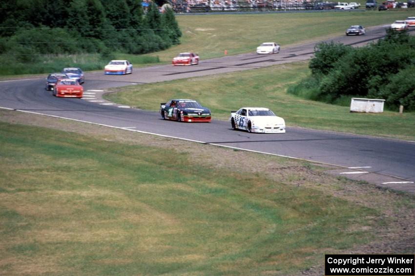 Glenn Allen, Jr.s Pontiac Grand Prix, Jay Sauter's Chevy Lumina and Mike Miller's Pontiac Grand Prix lead the rest of the field.