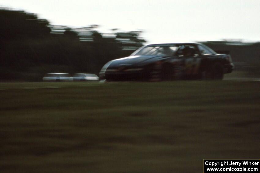 Harold Fair's Chevy Lumina gets bombarded with heavy rain during one of the qualifiers