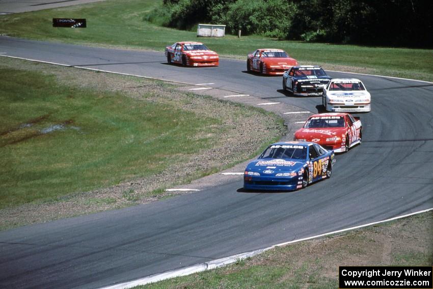 The front-runners stream through turn 8.