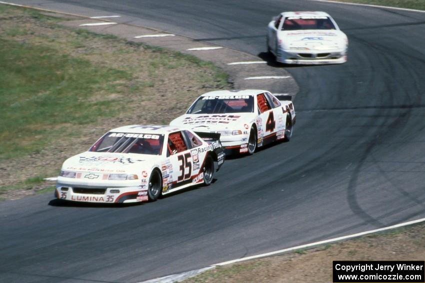 Chuck Hemmingson's Chevy Lumina, Dave Sensiba's Chevy Lumina and Steve Holzhausen's Pontiac Grand Prix