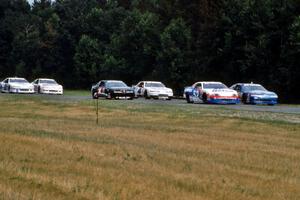 The field comes into turn 3 on the pace lap