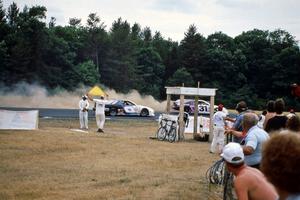 Rick Miller's Chevy Monte Carlo goes wide at 3 as Tom Jones' Pontiac Grand Prix catches him