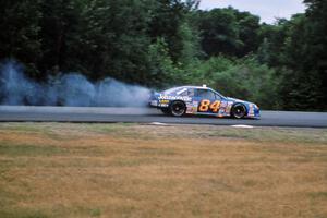 Bob Senneker pops an oil line and catches the engine of his Ford Thunderbird on fire