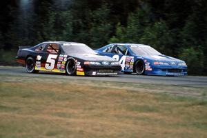 Bryan Reffner's Ford Thunderbird gets the inside line on Lou Gigliotti's Ford Thunderbird coming into turn 3